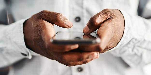 A person using a smartphone, photo.
