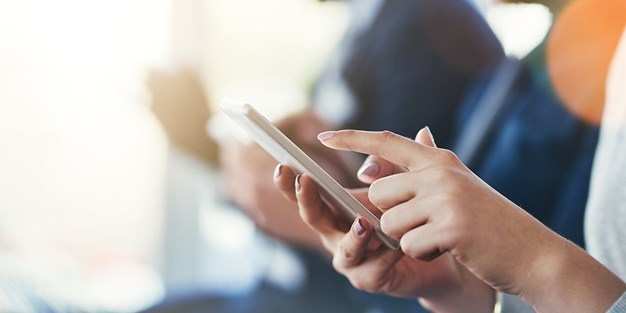 A person using a smartphone. Photo